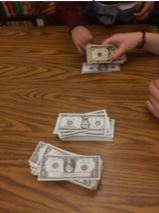 Counting money from ticket sales for our school play